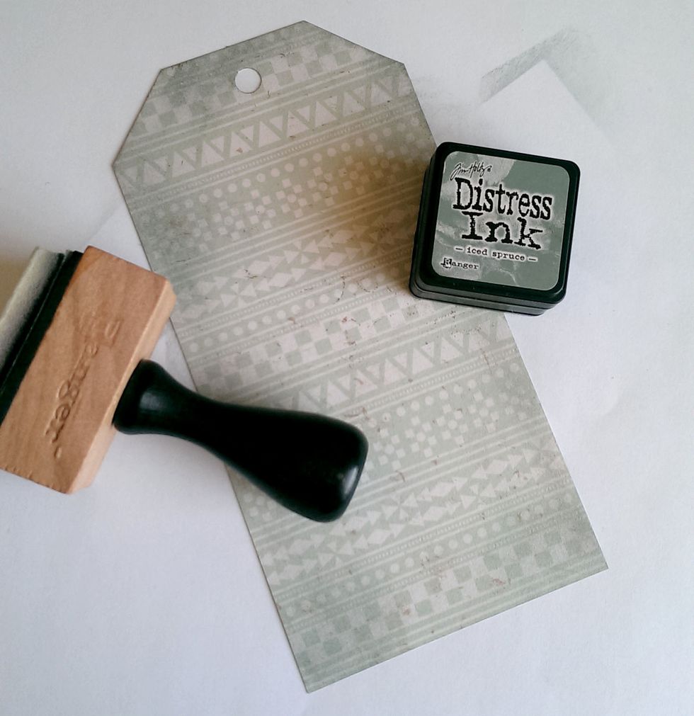 Using the Tim Holtz Iced Spruce Distress Ink, ink the edges of the tag.