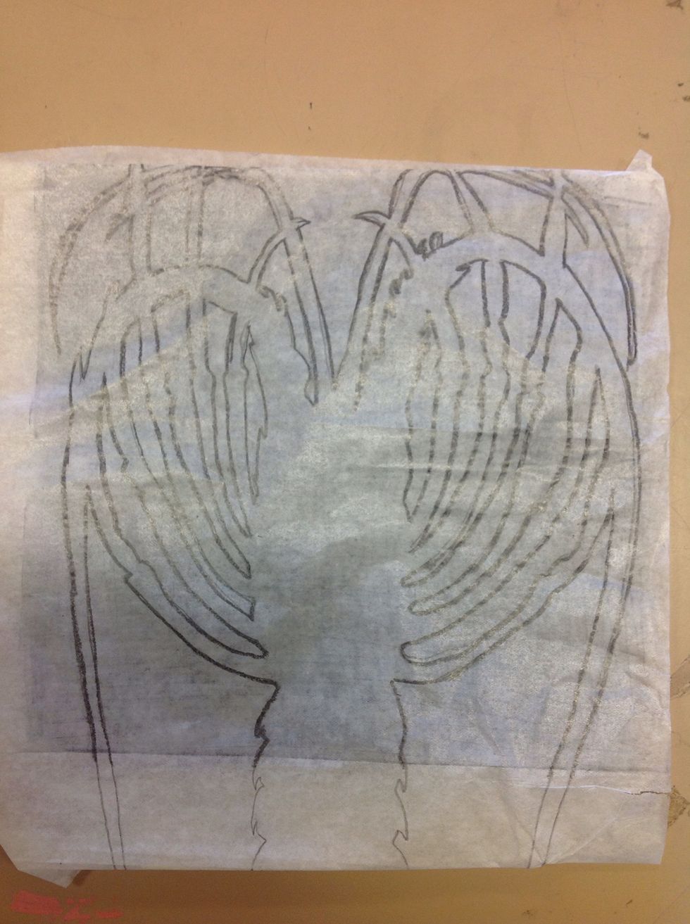 Using the tracing paper, trace around the outline of the animal. Don't worry about details at this point they can be drawn in later.