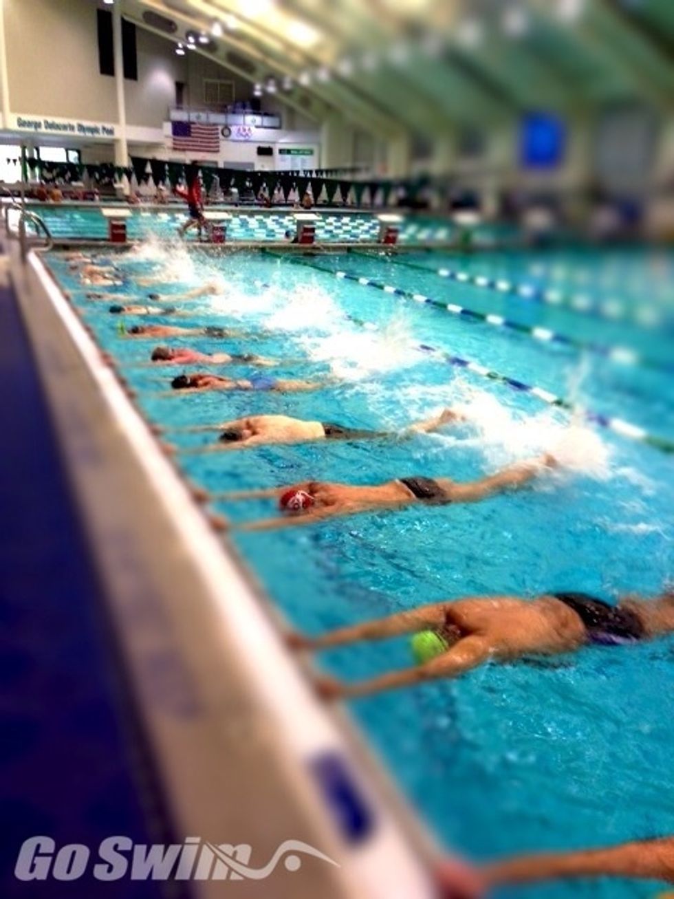 Using the wall or a kickboard, kick your legs up and down. Keeping your toes pointed and legs straight. This is known as freestyle kick.
