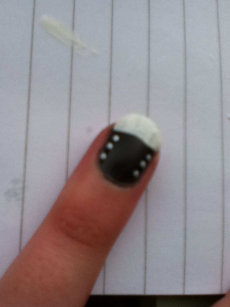 Using the white and a pencil, dot three dots either side of the nail.