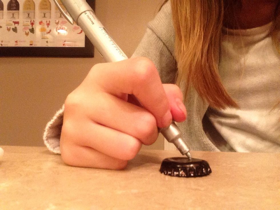 Using the white or silver marker draw dots in the shape of your favorite star constellation
