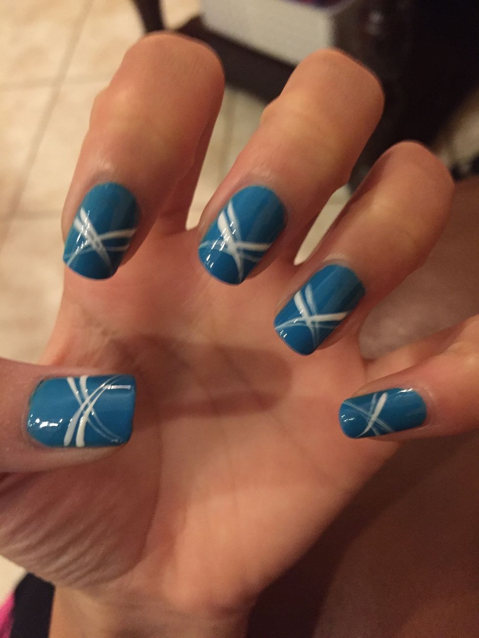 Using the white stripers make somewhat curved lines following a bow/x shape