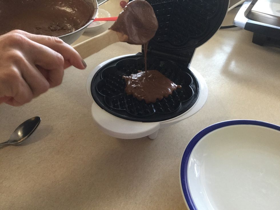 Using the wooden spoon scoop 1 1/2 onto the iron. And cook until golden brown (this makes about ten)