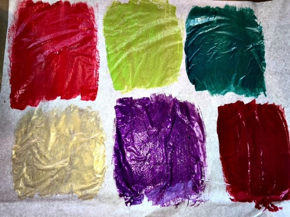 Using tissue paper, apply your different color paints and allow to dry completely.