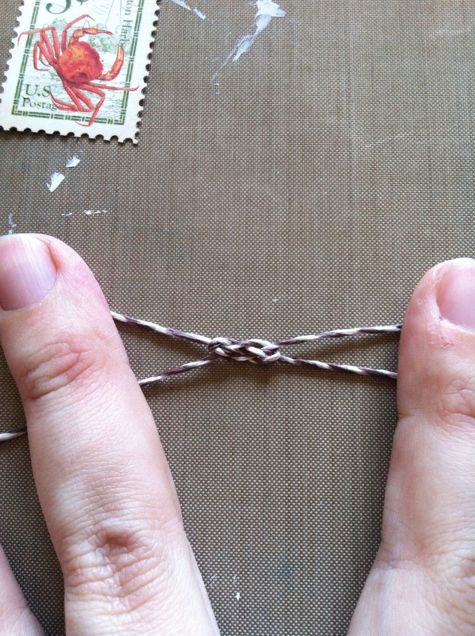 Using two pieces of twine, tie a Carricks Bend knot. I have a Snapguide how to tie one on my profile. My twine was about a foot long each, but you could probably get away with 4" or so.