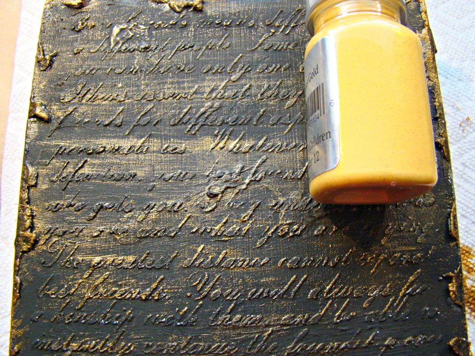 Using Vegas Gold Sorbet I dry brushed this the top of the stenciling on the back of the box.