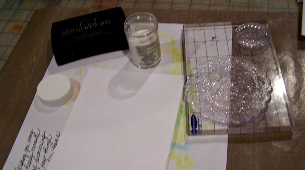 Using VersaMark stamp images onto white card stock, add clear embossing powder or gold and heat set