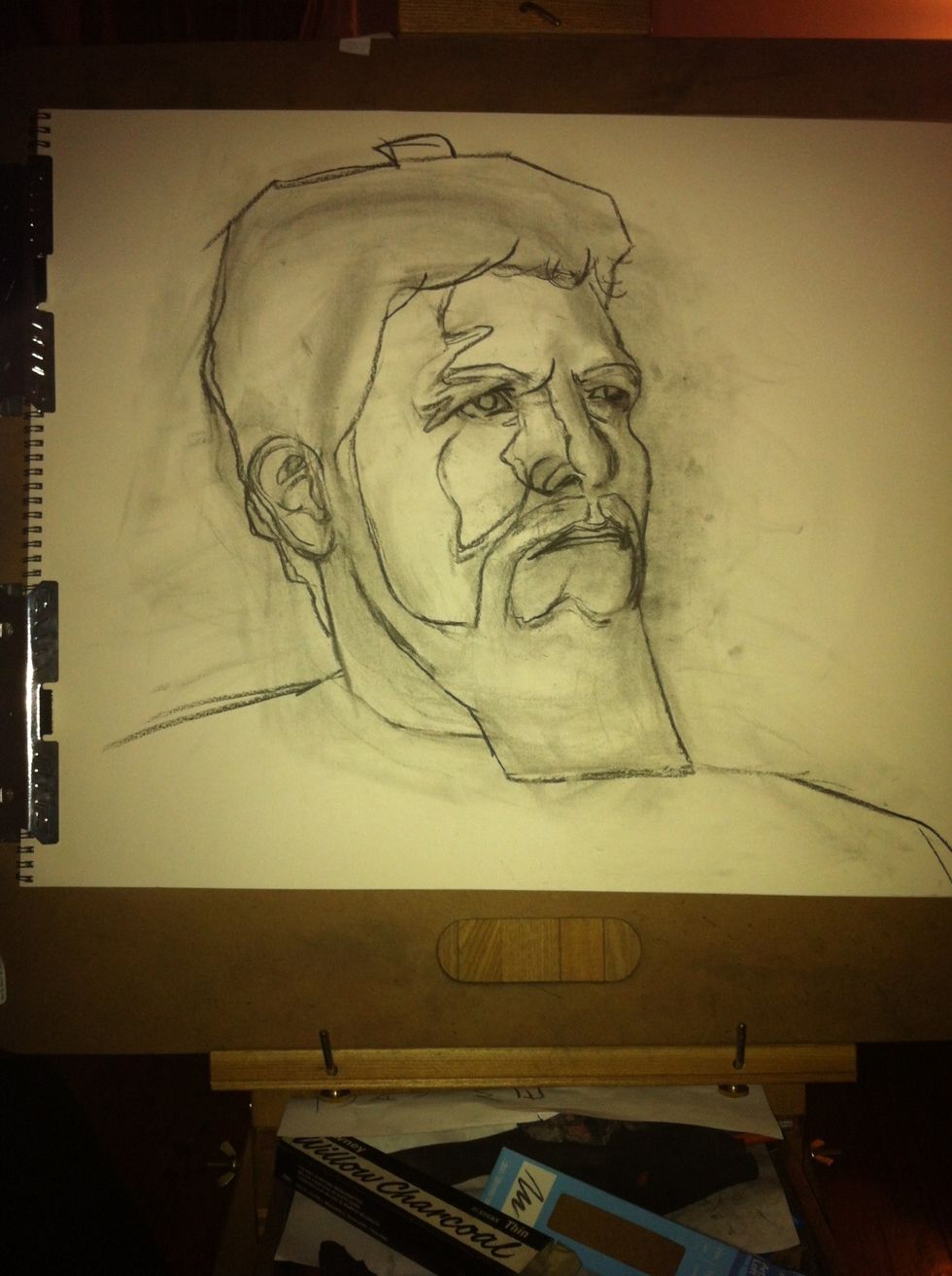 Using vine charcoal, lightly sketch the basic planes of the face using mostly straight lines. The straight lines will help you capture vibrancy and emotion that is essential to a good portrait.