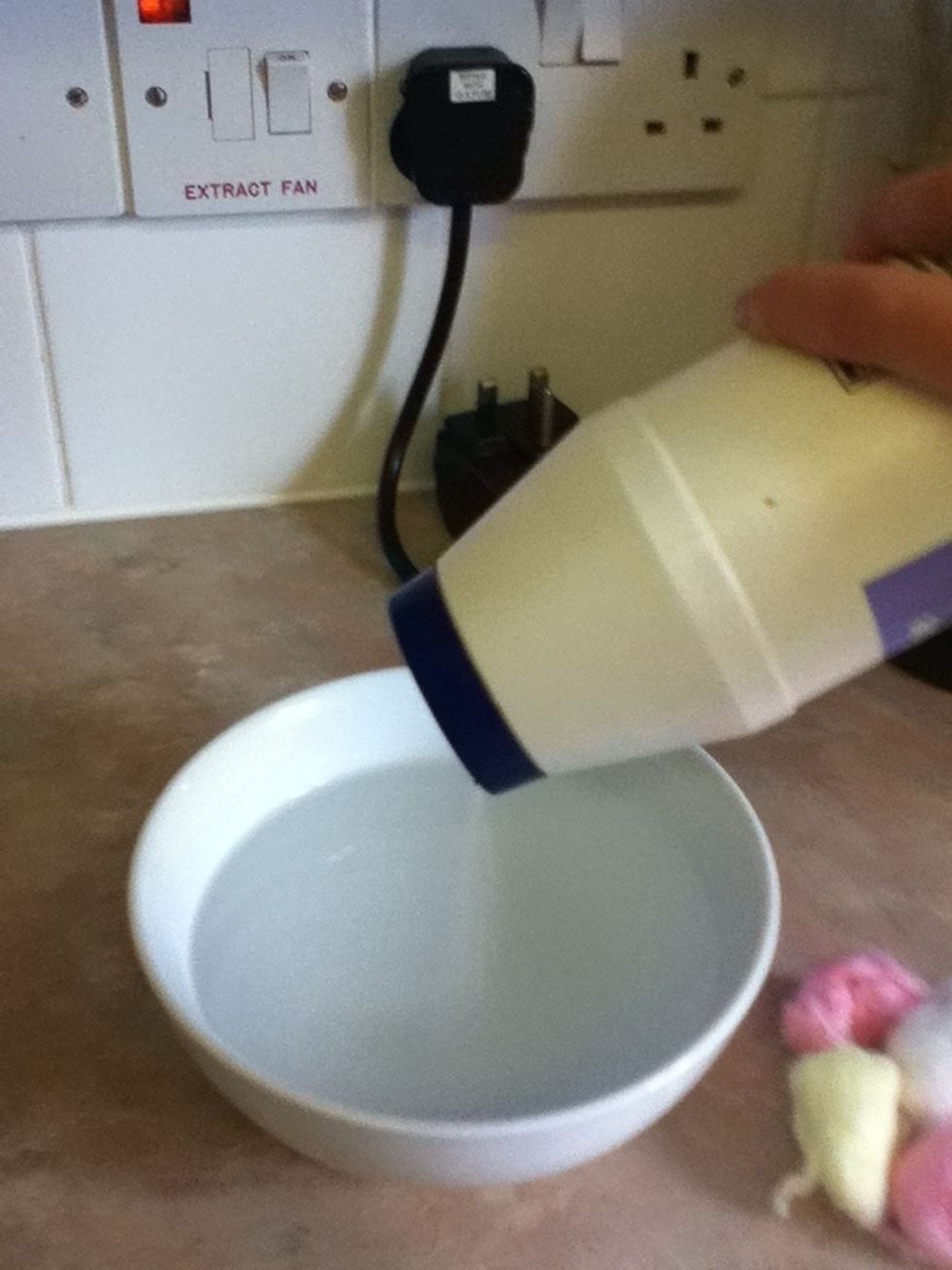 Using warm water, dissolve a good amount of salt into the water, about 2 tablespoons depending on how much water you use
