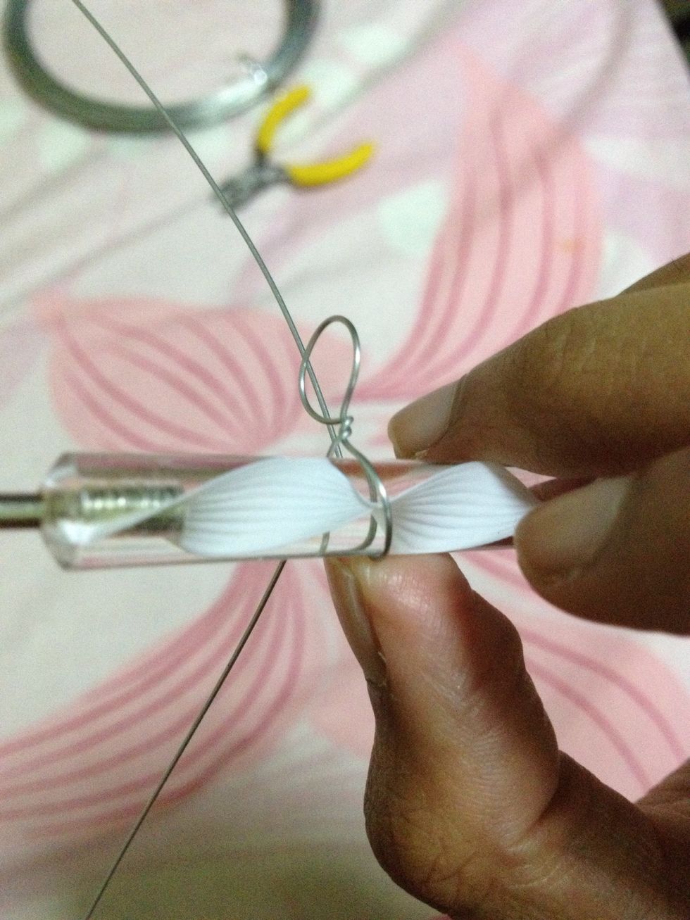 Using wire near to the stem of the completed petal, make the next petal following the previous steps. This is so that the 2 petals are facing the same centre, as should petals of a flower be.