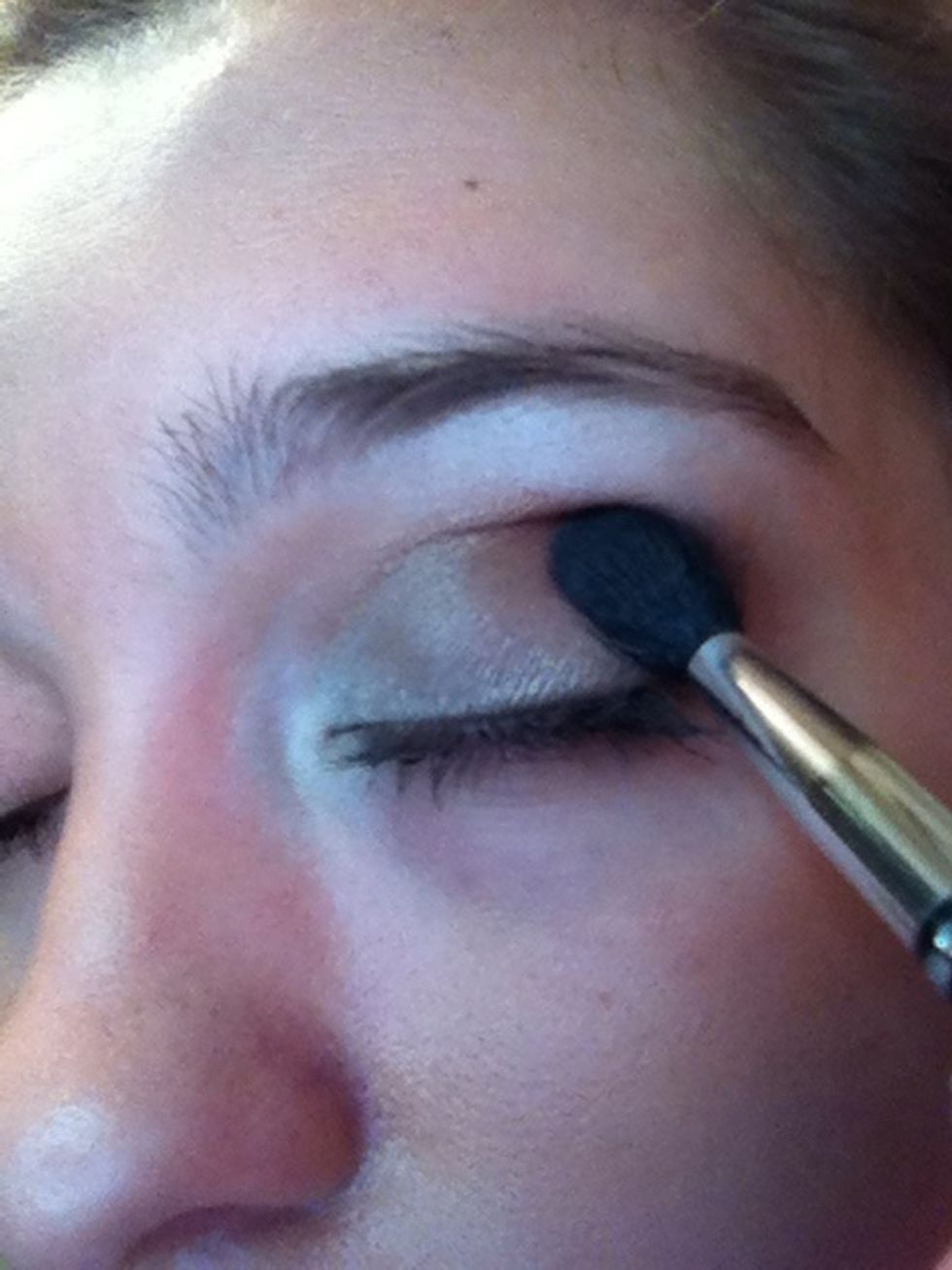 Using your crease brush blend the dark rosey color into your crease