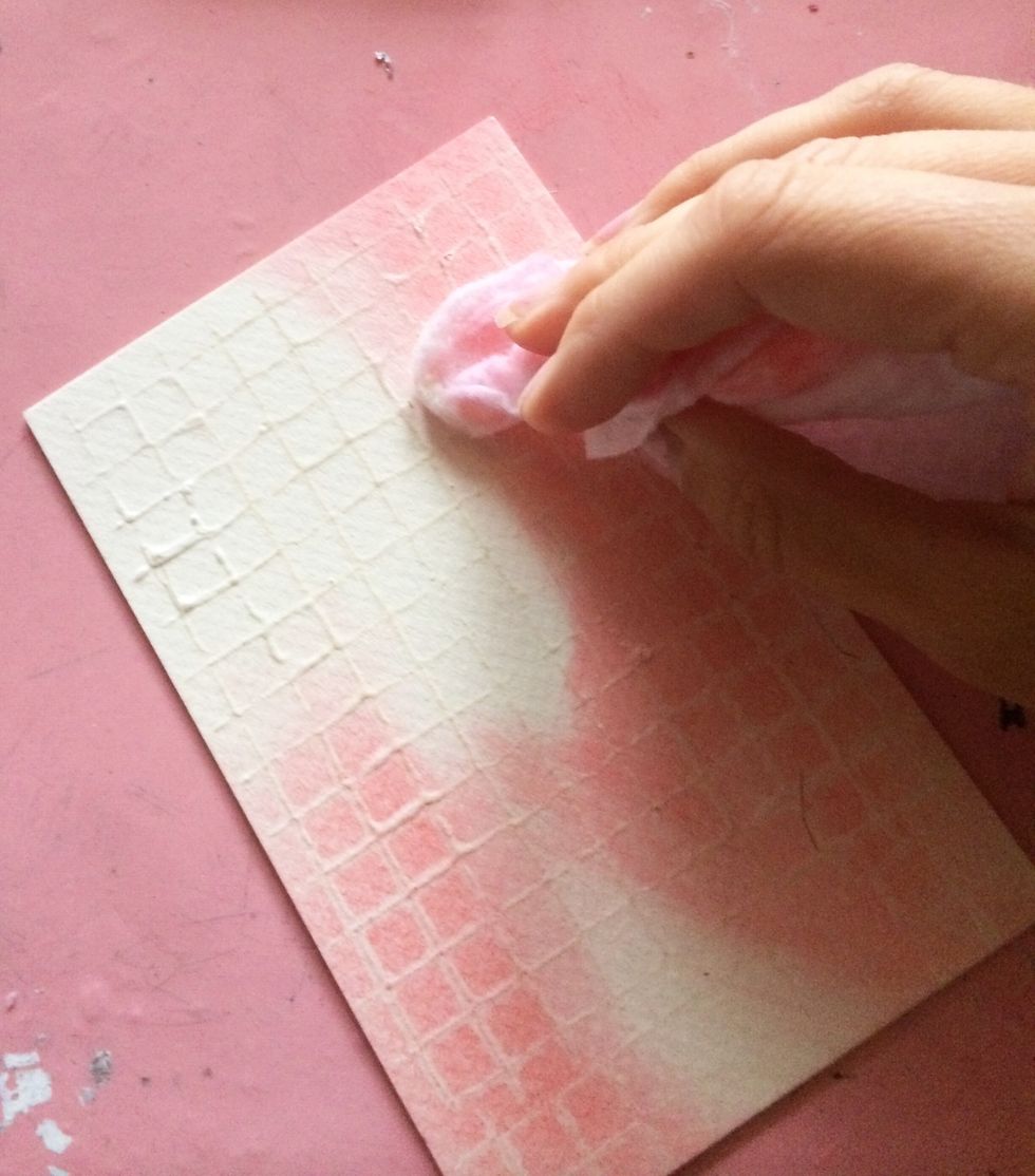 Using your dominant color, run your project with the gelato. Rub with your finger and then lightly with a baby wipe. Your goal is to get a watercolor effect and allow the clear gesso to come through.