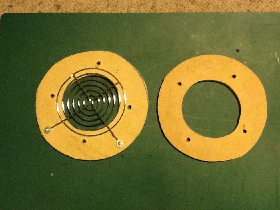 Using your fan as a template cut two rings in MDF (or similar material) with screw holes where the fans mounting points are located. On one of these rings attach the second fan guard