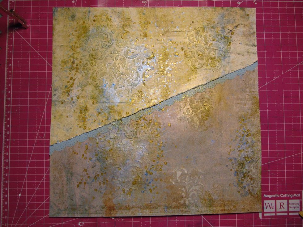 Using your favorite mist, spritz and splat until you are happy with the look. Baby wipes are your friend when doing this. We used the clear gesso first, the mist won't soak into the paper right away.