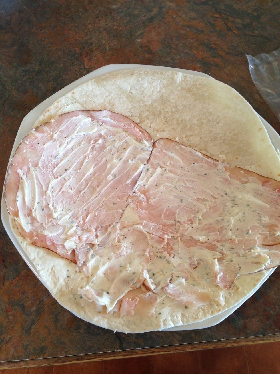 Using your fingers (it's much easier than using the spatula, which will tear the turkey apart), spread another THIN layer of cream cheese/ranch on top of turkey.