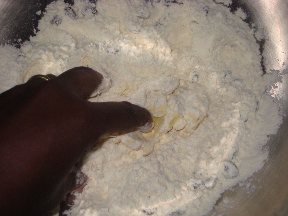 Using your fingers, rub the butter into the flour