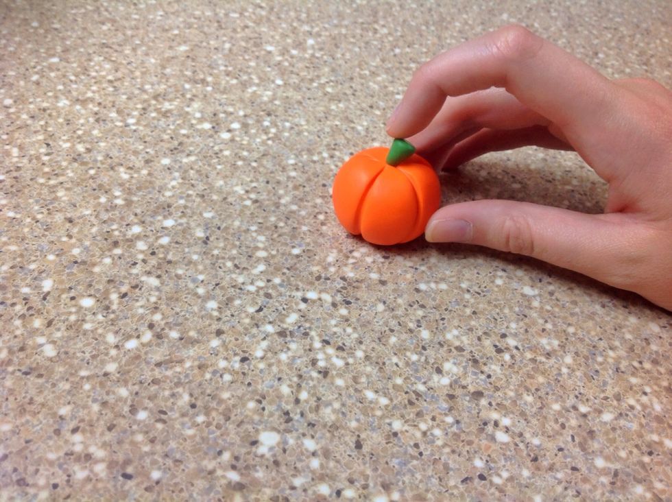 Using your fore finger, gently push down on the top of the stem. This little curve will give personality to your pumpkin.