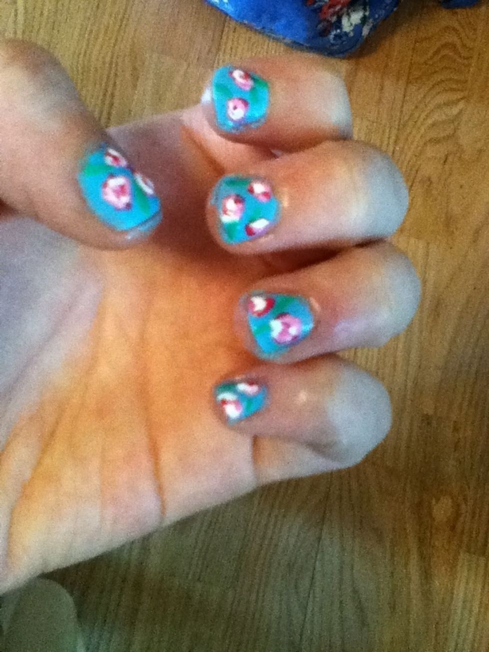 Using your green color, make little lines for leaves with a toothpick or striper.