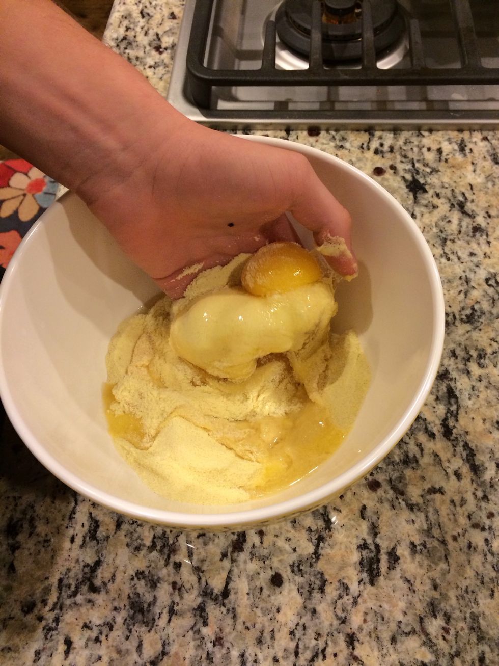 Using your hands, mix together the flour and eggs