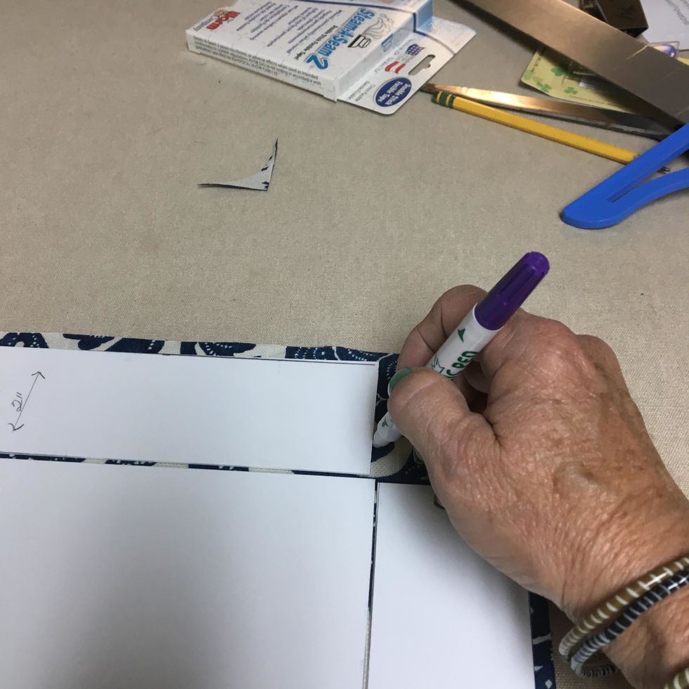 Using your invisible fabric marker, draw your stitch lines down all 4 sides of the basket starting at the top edge of the fabric, between the basket bottom and sides and ending at the bottom edge
