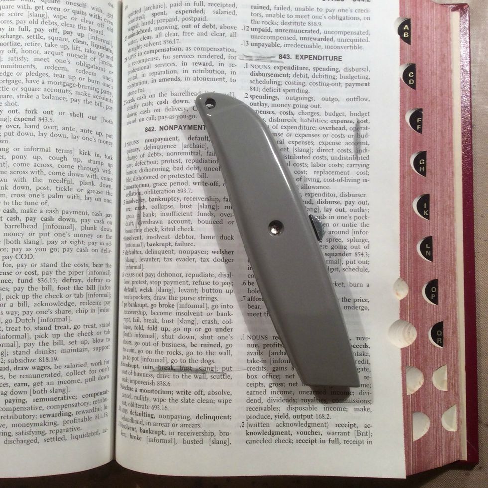 Using your knife start cutting out the inside to hold your photo.