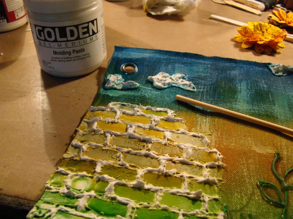 Using your Molding Paste, add in the crevices of your bricks. I used a wooden dowel to apply.