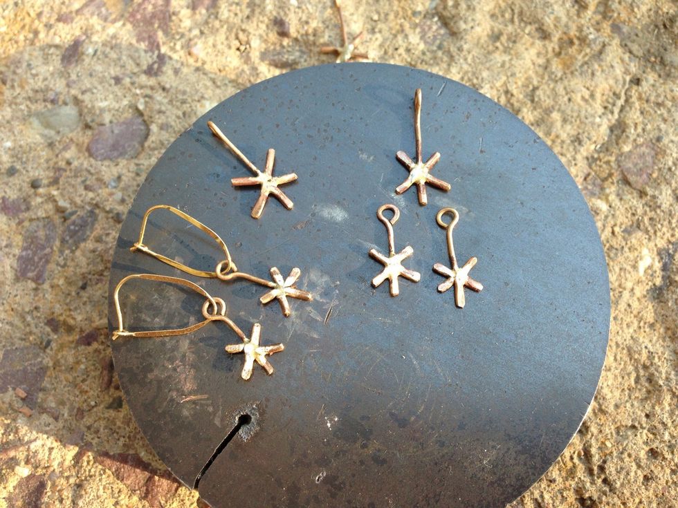 Using your needle nose pliers, curl the thin, longer spoke into a loop. I made the earring loops flat, and the pendant loops 90 degrees from flat, so each will hang correctly.