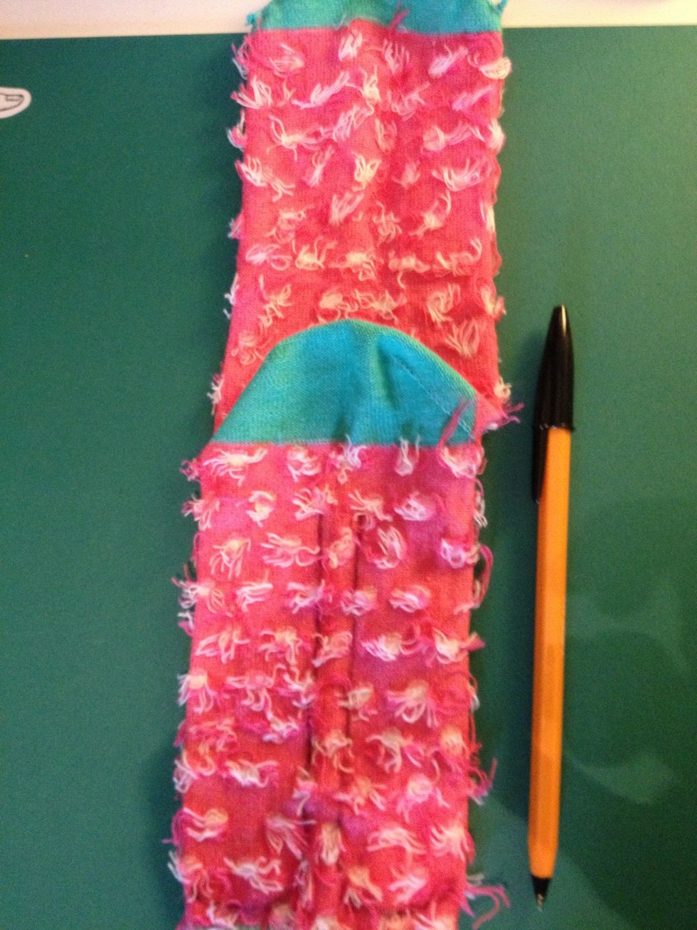 Using your pen draw legs for the sock monkey, leaving about a cm underneath the bottom and a half cm gap between the legs.