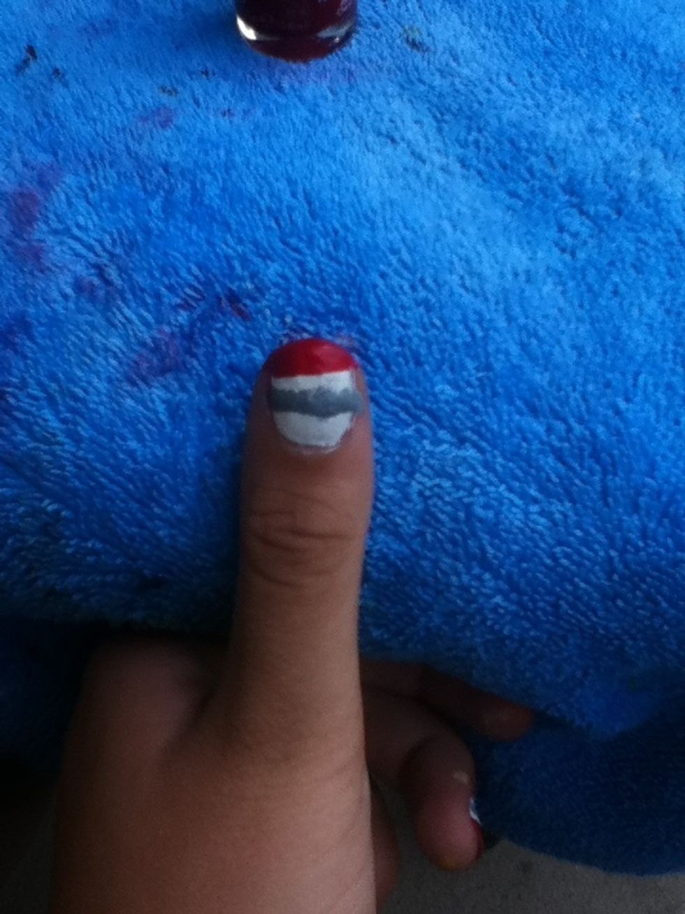 Using your red, create a rough line, and cover the top 1/4 of your nail.