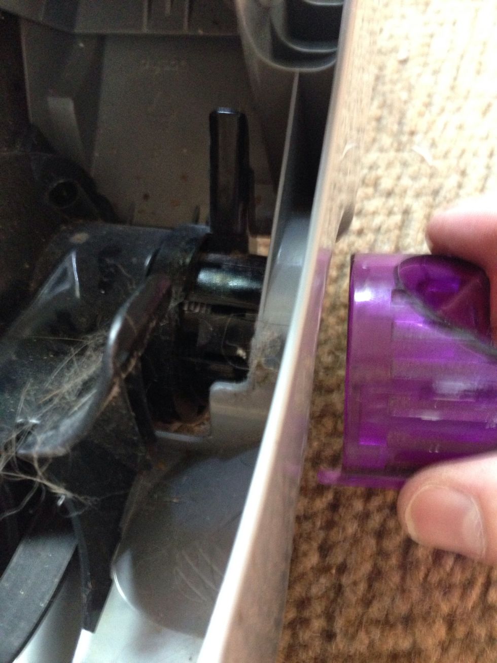 Using your same flathead screwdriver push out or snap out the carpet selector knob don't worry it won't break