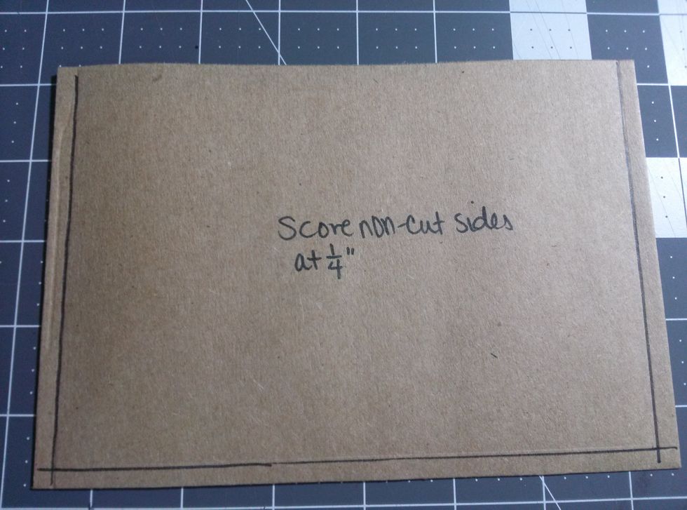Using your Scoring Board- score at 1/4" on each of the non-cut sides.