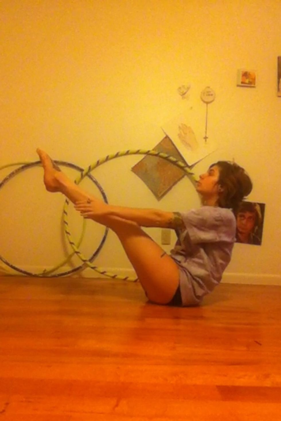 Using your sit bones stabilize your bottom on the floor, engage your core, straighten your back and lift your legs and torso, squeeze your body like you are trying to bring your chest to your thighs