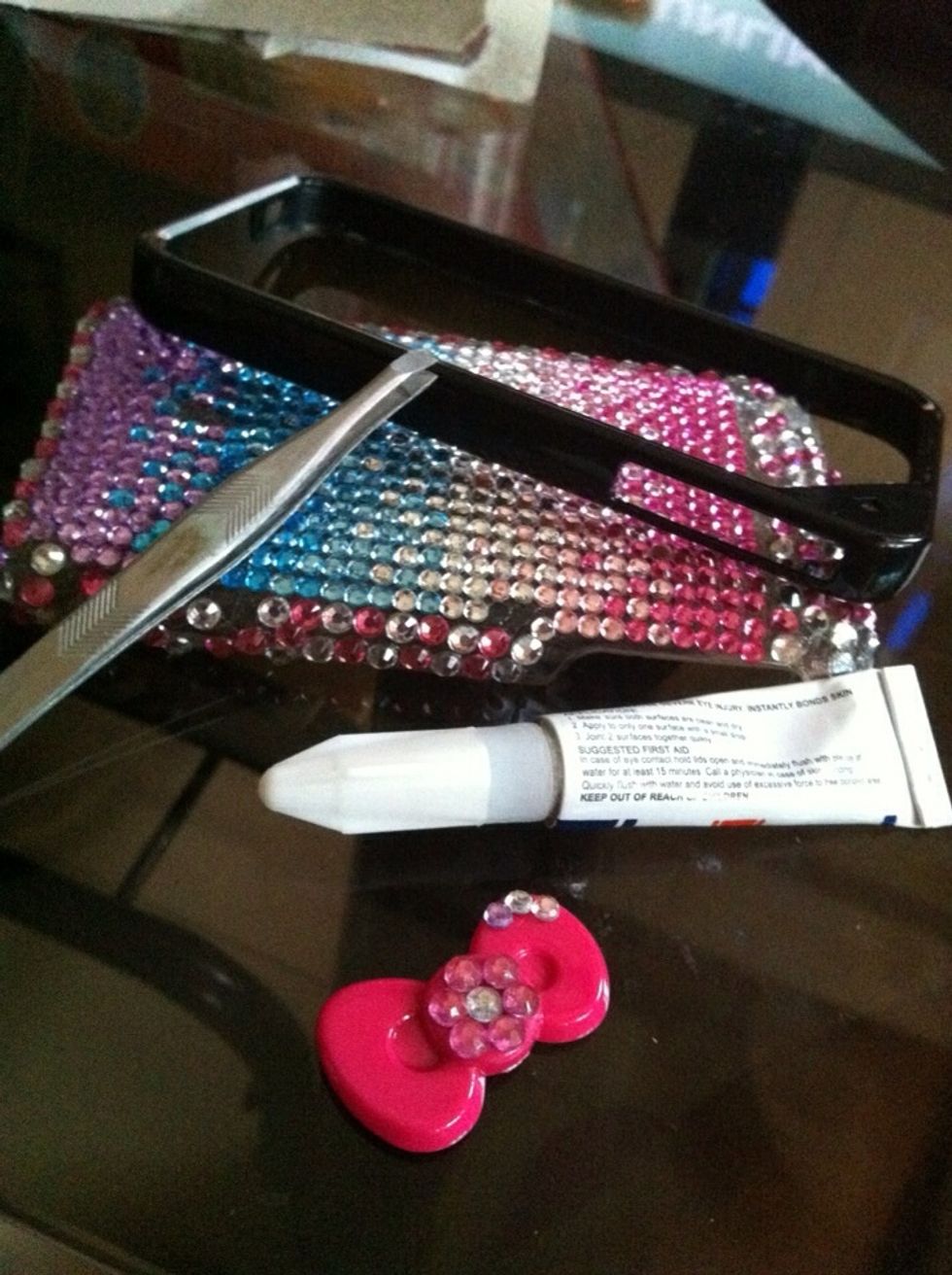 Using your super glue, attach your blings to your ribbons.