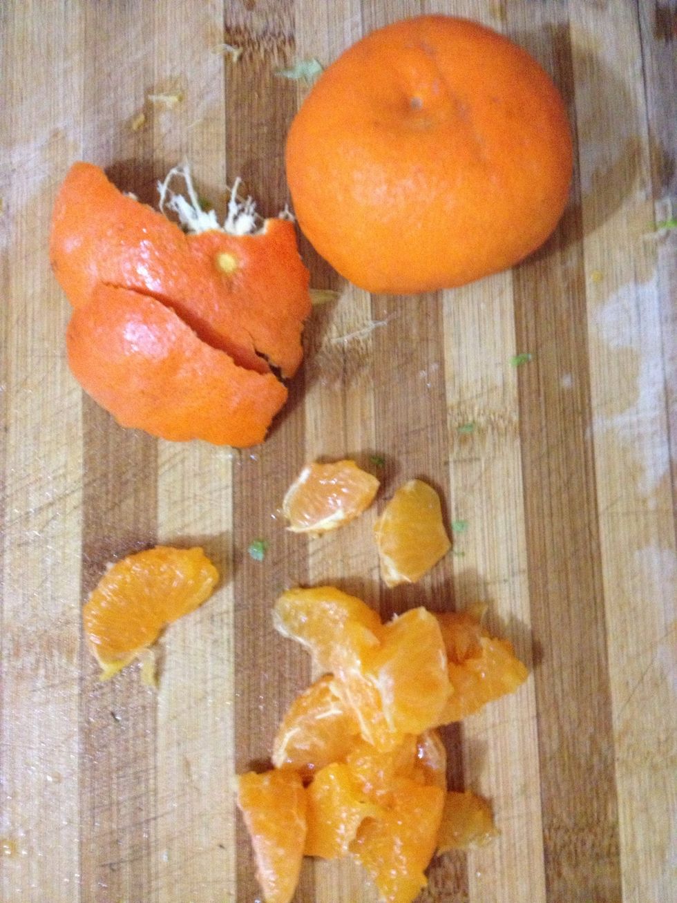 Using your thumbnail, peel the tangerine skin. Separate the tangerine slices. Remove the peels from the slices