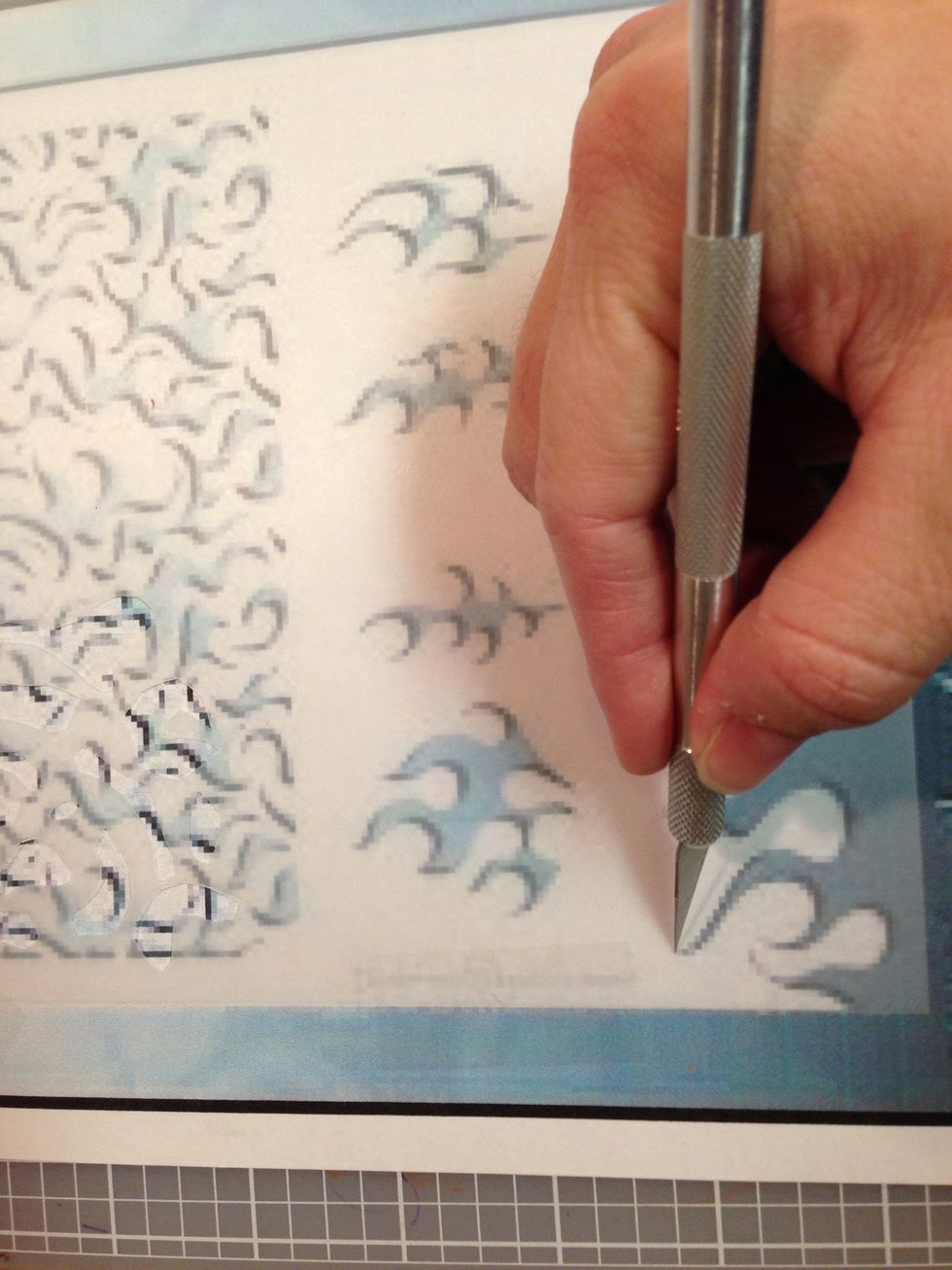 Using your X-Acto knife (CAREFULLY), cut the blank stencil sheet.