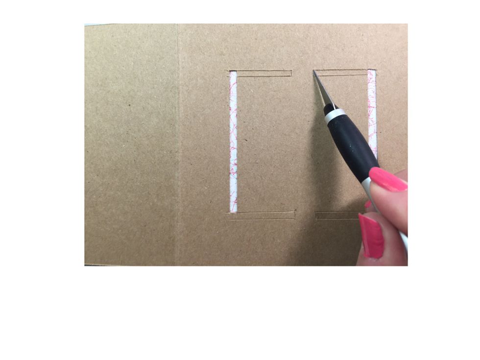 Using your X-acto tool cut the notch to release the side cuts as shown.