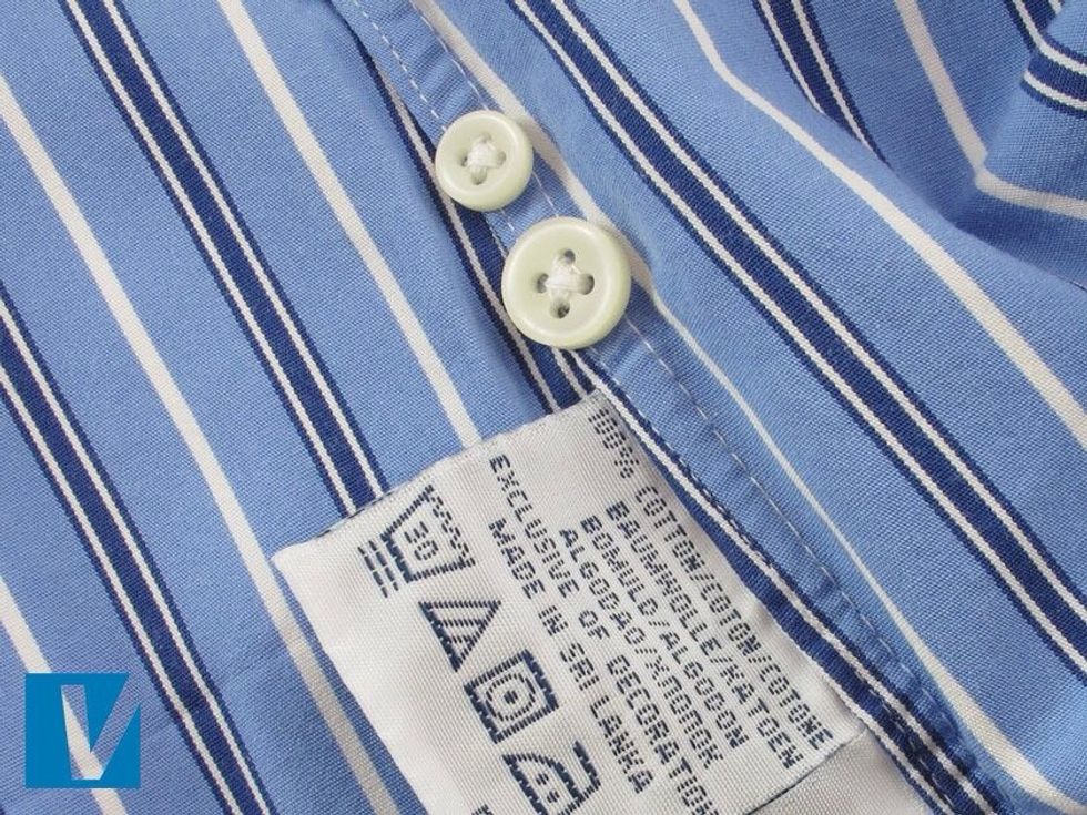 Usually 2x spare buttons are supplied, one large, one small. Often located just above the care label they are the same opaque pearl colour as those found on the front of the shirt.