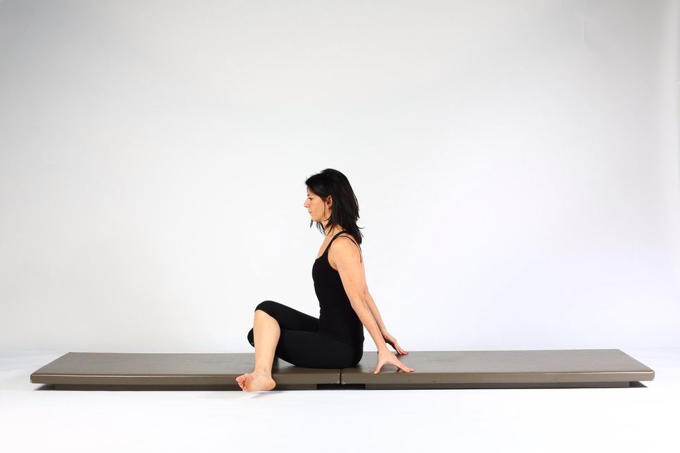 Variation 2. Push your body forward so you are sitting tall and one knee is on top of the other. (Note- if you are tight the feet may be closer to the legs than in the picture.)