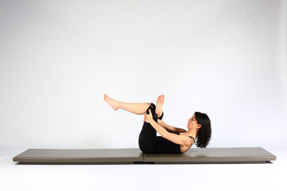 Variation 4. Lie on back and cross right foot over left knee. Hold behind left thigh and pull your thigh close to your body. (Head can be up or down).