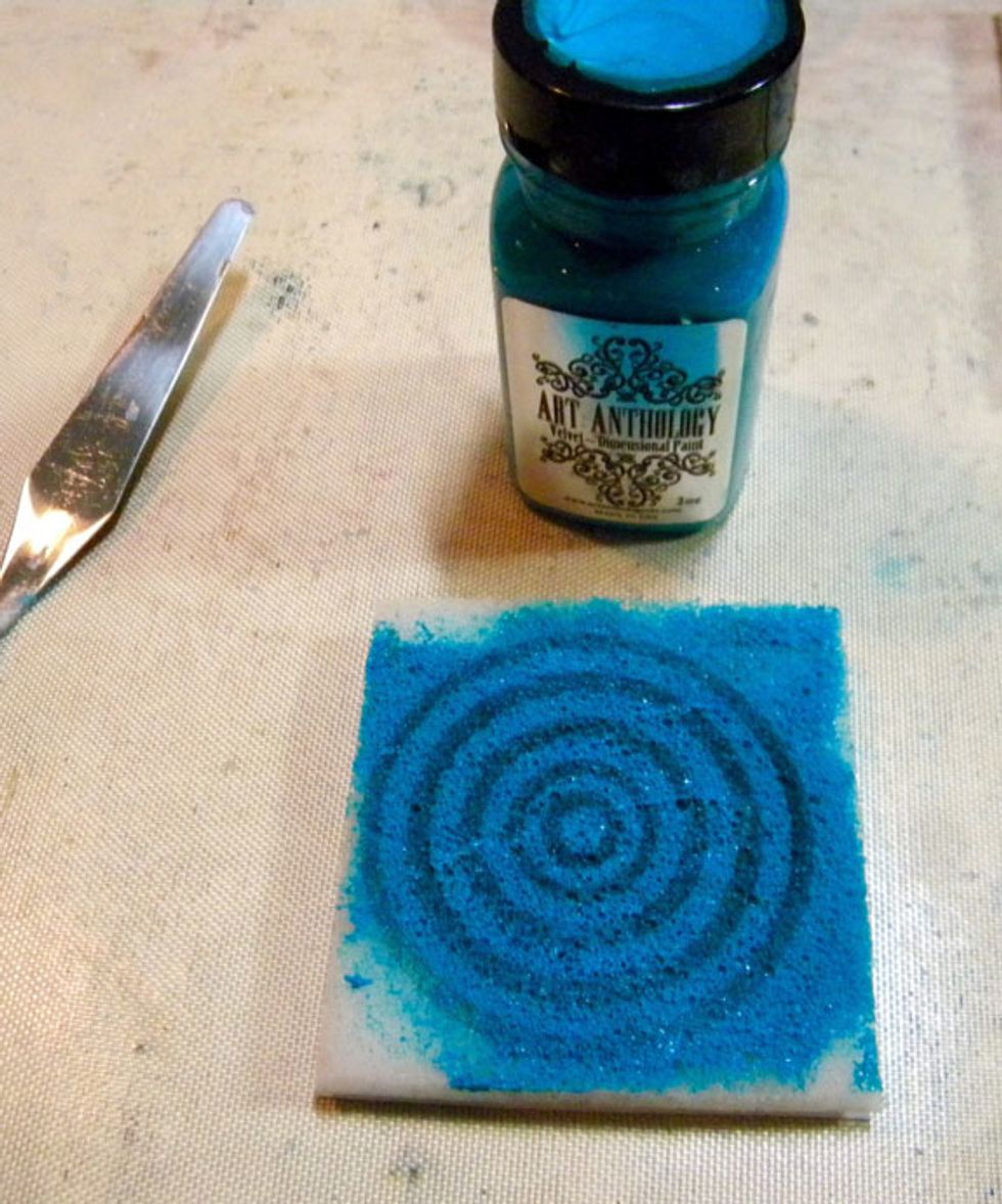 Velvets work great with ArtFoamies too. Since they are dimensional mediums, they sit on top of the paper or fabric. Just add a liberal amount to the Stamp Buddy and spread to coat the image.
