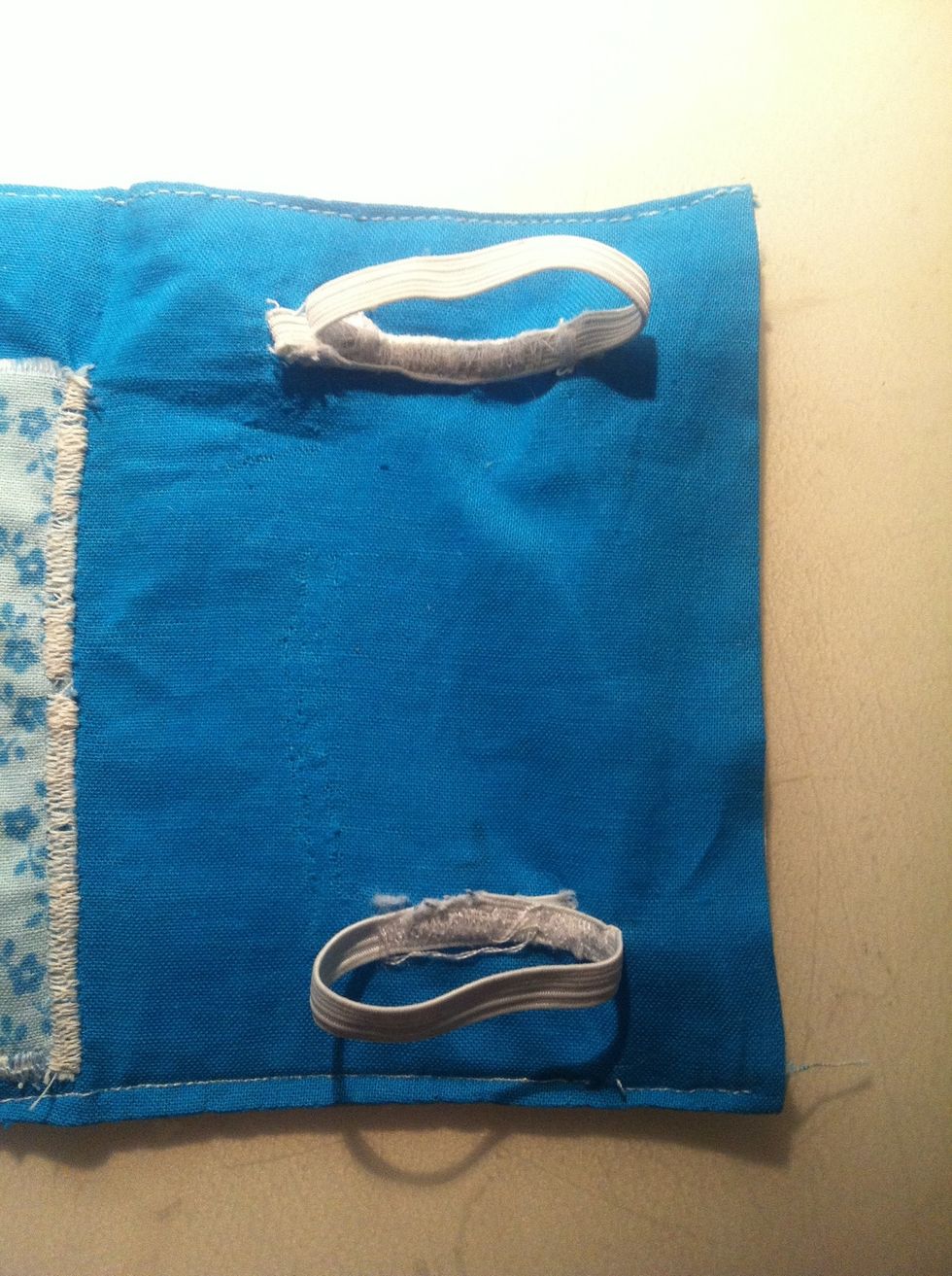 VERY CAREFULLY AND SLOWLY sew your elastic on. They need to be less than half your phone's width. Measure it so it will fit your phone. Sew a few times to make sure it will not snap or undo!