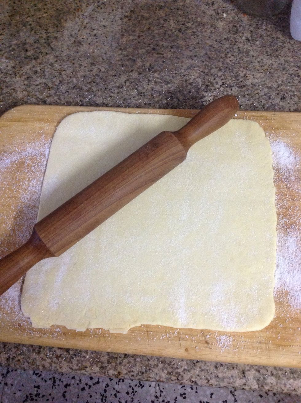 VERY gently roll with a rolling pin, you do not want to roll out the pastry, you just want to press the sugar into it.