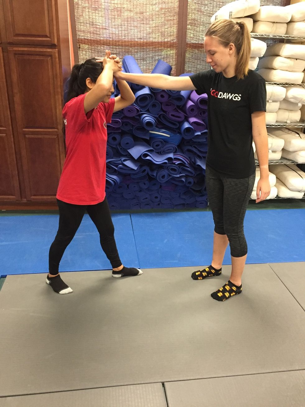 Victim steps back to get in a better stance.