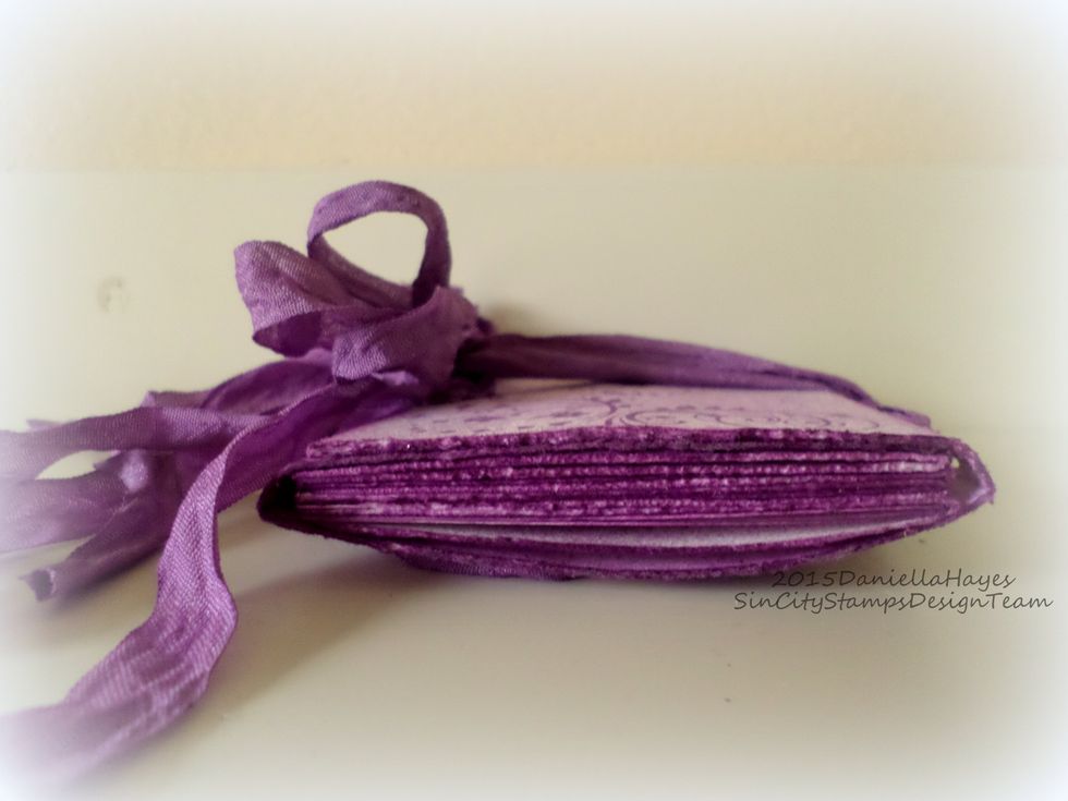 View from the side. There is tons of room inside this book! The additional score lines on the spines make the book easy to fold up tight, or fill up!