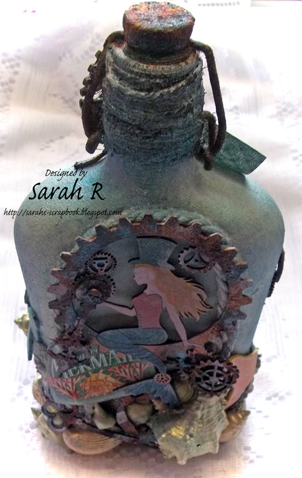 View of the top/back of the Mixed Media Altered Bottle.