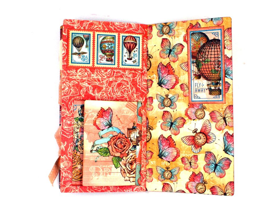View with ephemera card folded in on the page.  Locate cut-apart shown on Castles in the Air and adhere inside the back signature cover.