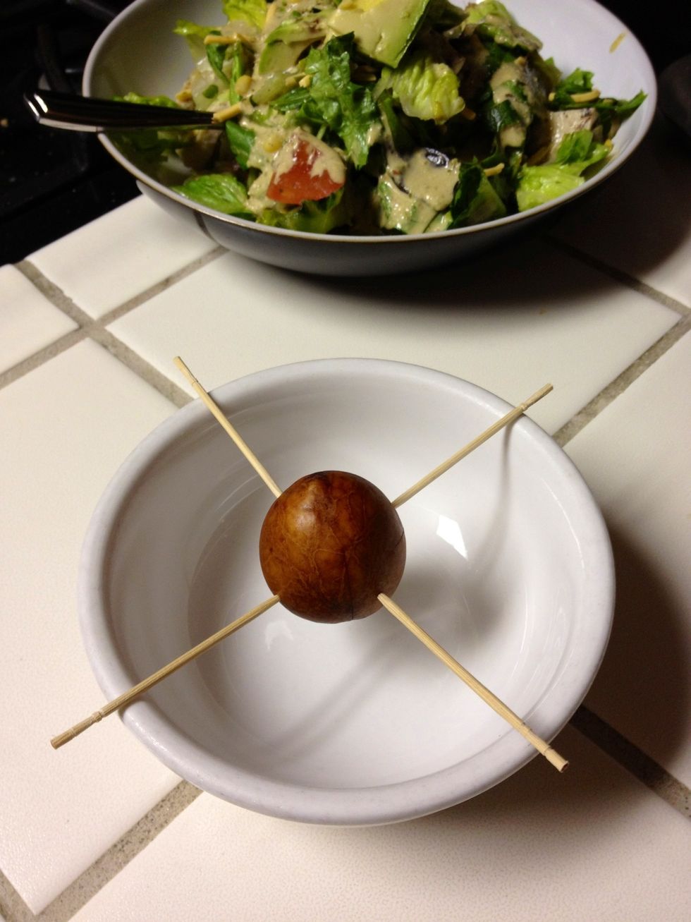 Viola! If you've angled your toothpicks slightly upward you'll find that the seed sits down in the bowl a little better which will make it so you don't have to fill the bowl to the brim with water.