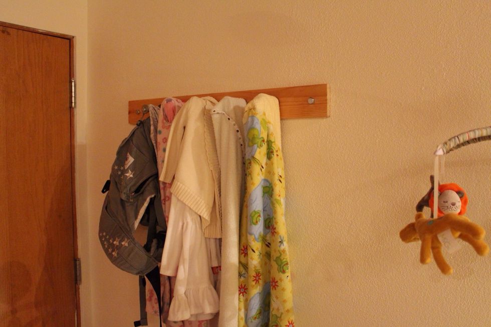 Viola! You can now have a coat/towel rack that matches the barn door you might have made. And most of all your mate thinks your so "McGyverish" for using everything you overspent on at Home Depot.