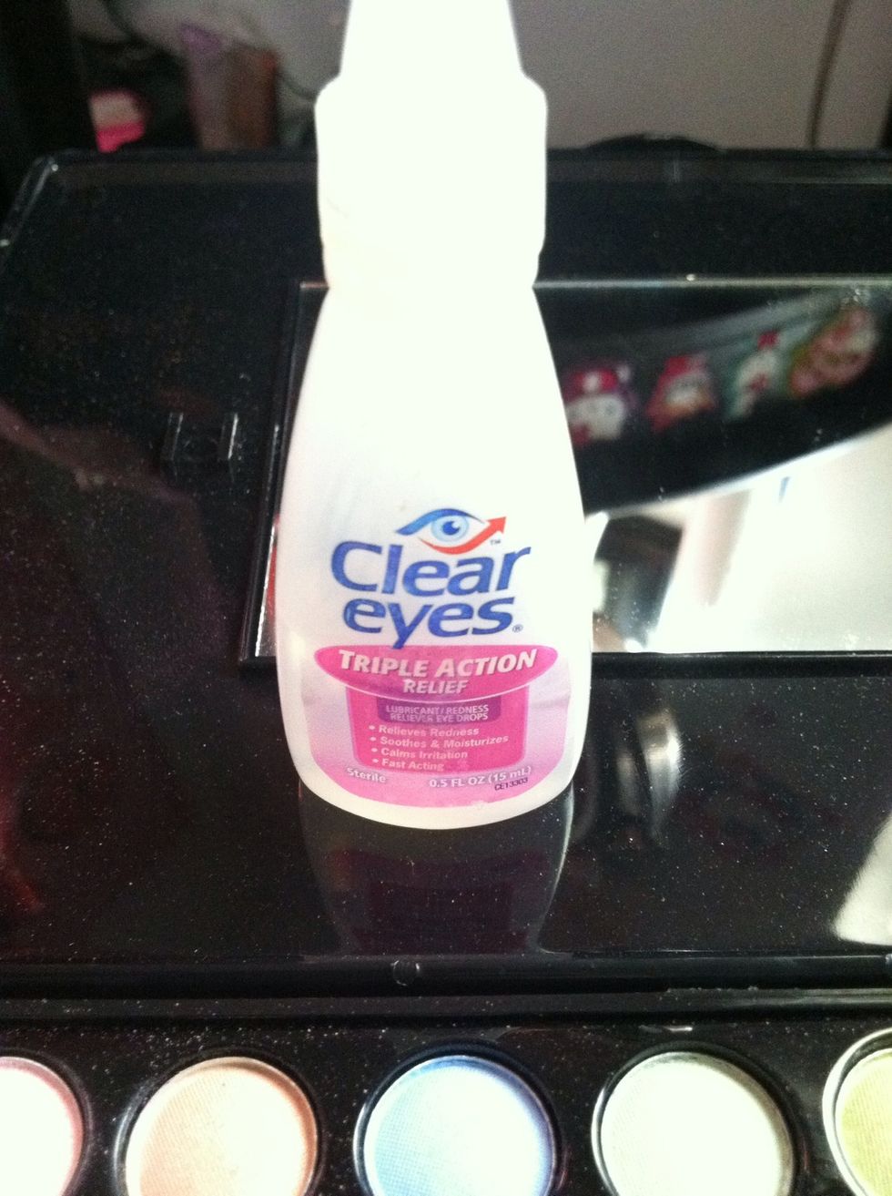 Visine or similar eye drops. You can use water but water flakes when it dries. Visine or clear eyes keeps your liner smooth.
