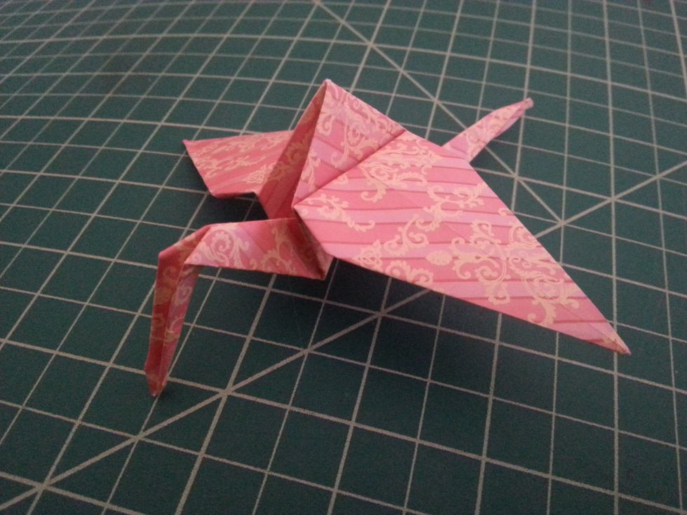 VOILA! :D Take the bird by it's tail and set it upright, similar to the picture above and shazam! This is our crane!